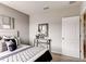 Bright bedroom with a white headboard bed, neutral walls, and carpet flooring at 3617 Fort Mellon Ln, Sanford, FL 32773