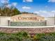 Welcoming community sign, Concorde, featuring a decorative stone base and flowing water feature at 3617 Fort Mellon Ln, Sanford, FL 32773