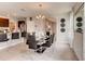 Modern dining room featuring a glass table, elegant chandelier, and open concept design at 3617 Fort Mellon Ln, Sanford, FL 32773