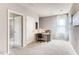 Loft space featuring neutral walls, carpet floors, and a desk with a chair by the window at 3617 Fort Mellon Ln, Sanford, FL 32773