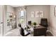 Cozy home office with a dark wood desk, modern decor, and bright window at 3617 Fort Mellon Ln, Sanford, FL 32773