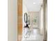 Beautiful and bright hallway with tile flooring, and decorative mirror that adds a touch of elegance at 3641 Fort Mellon Ln, Sanford, FL 32773