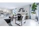 Bright and airy living room with tile floors, modern decor, and a large window offering natural light at 3641 Fort Mellon Ln, Sanford, FL 32773