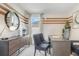 Stylish office with a modern desk, comfortable seating, and a decorative mirror at 3641 Fort Mellon Ln, Sanford, FL 32773