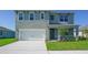 Charming two-story home featuring a gray exterior, well-maintained landscaping, and an attached two-car garage at 3846 Royal Azalea Way, Sanford, FL 32773