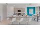 Modern kitchen with granite countertops, stainless steel appliances, and a central island with seating at 3846 Royal Azalea Way, Sanford, FL 32773