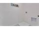 Practical laundry area with hookups, utility sink, and clean, white walls, offering functionality and simplicity at 3846 Royal Azalea Way, Sanford, FL 32773