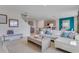 Open-concept living space with modern furnishings and seamless transition to kitchen at 3846 Royal Azalea Way, Sanford, FL 32773