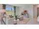 Bright living room features a large window view and modern furnishings at 3846 Royal Azalea Way, Sanford, FL 32773