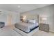 Spacious main bedroom featuring soft carpet, a comfortable bed, and ample natural light at 3846 Royal Azalea Way, Sanford, FL 32773