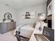 Cozy bedroom features modern furniture, decor, and ample space for relaxation at 3850 Royal Azalea Way, Sanford, FL 32773