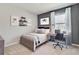 Comfortable bedroom with decor, neutral colors, desk, and natural light at 3850 Royal Azalea Way, Sanford, FL 32773