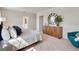 Bedroom with wooden furniture, carpeted floors, and light entering from open doorway at 3850 Royal Azalea Way, Sanford, FL 32773
