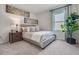 Comfortable bedroom with plush carpet, ample natural light, and stylish décor at 3850 Royal Azalea Way, Sanford, FL 32773