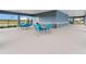 Outdoor community area offers tables and seating with a covered area for shade near pool and other amenities at 3850 Royal Azalea Way, Sanford, FL 32773
