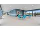 Outdoor community area offers tables and seating with a covered area for shade near pool and other amenities at 3850 Royal Azalea Way, Sanford, FL 32773