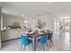 Modern dining room that is open to the living area with seating for four at 3850 Royal Azalea Way, Sanford, FL 32773