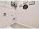 Well-organized laundry room featuring wire shelving, signs, tile floor, and essential hookups at 3850 Royal Azalea Way, Sanford, FL 32773