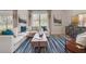 Bright living room featuring plush sofa, stylish decor, and expansive windows at 3850 Royal Azalea Way, Sanford, FL 32773