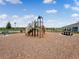 Community playground with wood chips, picnic table, benches, and view of the neighborhood at 3850 Royal Azalea Way, Sanford, FL 32773