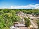 Expansive aerial view of the property showcasing the lush surrounding landscape and neighborhood charm at 398 Rose St, Umatilla, FL 32784