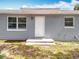 Backyard exterior featuring a door that leads to the interior of the home at 398 Rose St, Umatilla, FL 32784