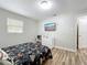 Bedroom with a bed, TV and dresser at 398 Rose St, Umatilla, FL 32784