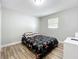This bedroom features a modern color scheme and laminate flooring at 398 Rose St, Umatilla, FL 32784