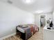 Bedroom featuring a bed and a dresser with TV at 398 Rose St, Umatilla, FL 32784