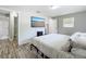 This bedroom has a TV and laminate floors at 398 Rose St, Umatilla, FL 32784