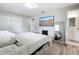 This bedroom has laminate floors, closet, and connected bathroom at 398 Rose St, Umatilla, FL 32784