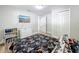 This bedroom has a TV and laminate floors at 398 Rose St, Umatilla, FL 32784