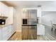 Kitchen featuring a stainless steel LG refrigerator and granite countertops at 398 Rose St, Umatilla, FL 32784