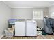 Well-lit laundry room equipped with modern washer and dryer units at 398 Rose St, Umatilla, FL 32784