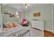 Cute bedroom with colorful decor, including a soft chair and white dresser at 5102 Monticello Heights Ln, Oviedo, FL 32765