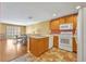 Functional kitchen with appliances, and an adjacent dining area for convenient meals at 5102 Monticello Heights Ln, Oviedo, FL 32765
