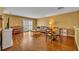 Spacious living room with hardwood floors, a large window, and comfortable seating arrangement at 5102 Monticello Heights Ln, Oviedo, FL 32765