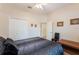 Well-lit bedroom featuring double closets, neutral paint, and simple decor creating a cozy atmosphere at 530 Heatheroak Cv, Altamonte Springs, FL 32714