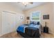 Cozy bedroom with a double closet, a window, and decor at 530 Heatheroak Cv, Altamonte Springs, FL 32714