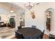Inviting dining space adjacent to the living room, featuring a round table and chandelier at 530 Heatheroak Cv, Altamonte Springs, FL 32714