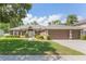 Charming single-story home featuring a two-car garage, lush green lawn, and neatly trimmed landscaping at 530 Heatheroak Cv, Altamonte Springs, FL 32714