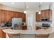 This kitchen features stainless steel appliances, granite countertops and wood cabinets at 530 Heatheroak Cv, Altamonte Springs, FL 32714