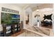 Cozy living room featuring wood floors, an entertainment center, and an open concept design at 530 Heatheroak Cv, Altamonte Springs, FL 32714