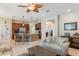 Open-concept living room showcasing a spacious layout and seamless transition to kitchen at 530 Heatheroak Cv, Altamonte Springs, FL 32714