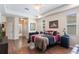 A bright main bedroom with wood floors and tray ceilings with lots of windows at 530 Heatheroak Cv, Altamonte Springs, FL 32714