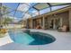 Outdoor pool area features a spacious patio, seating, and well-maintained landscaping at 530 Heatheroak Cv, Altamonte Springs, FL 32714