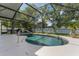 A beautiful screened-in pool with a white concrete deck and lush landscaping at 530 Heatheroak Cv, Altamonte Springs, FL 32714