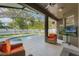 Relaxing screened-in patio with a pool, outdoor seating, and scenic backyard views at 530 Heatheroak Cv, Altamonte Springs, FL 32714