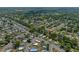 Aerial view displays the neighborhood's layout with cozy homes, green spaces, and winding roads at 5583 Miles Dr, Port Orange, FL 32127