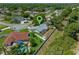 Aerial shot with a pin showing the property, backyard with screened patio and storage shed at 5583 Miles Dr, Port Orange, FL 32127